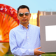 Xiulin Ruan holds up his lab’s sample of the whitest paint on record. That’s some white paint!